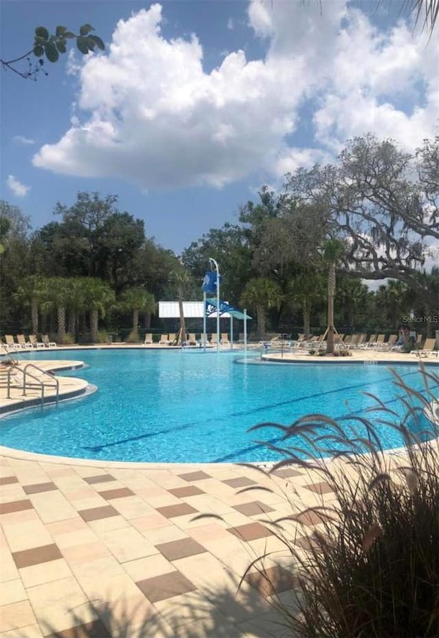 pool with a patio