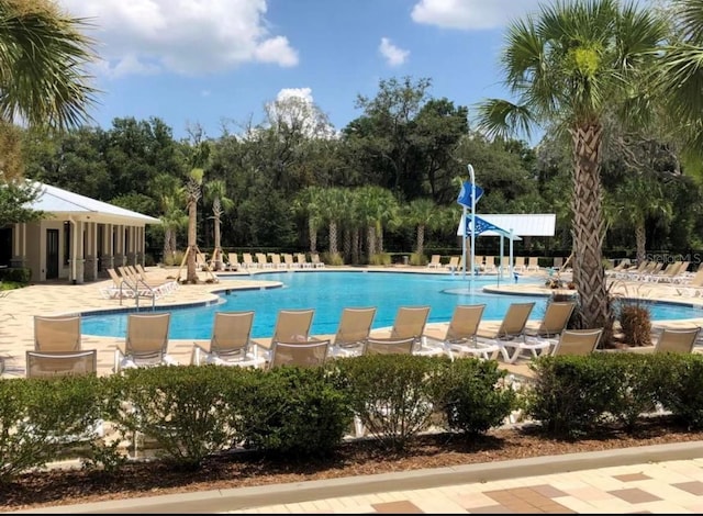 community pool with a patio