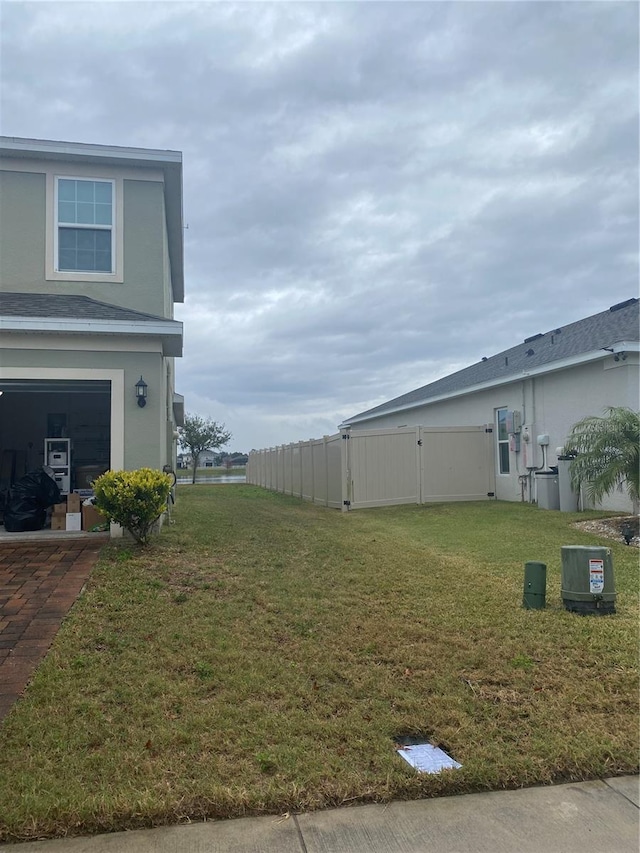 view of yard featuring a gate and fence