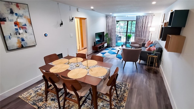 dining room featuring recessed lighting, wood finished floors, visible vents, and baseboards