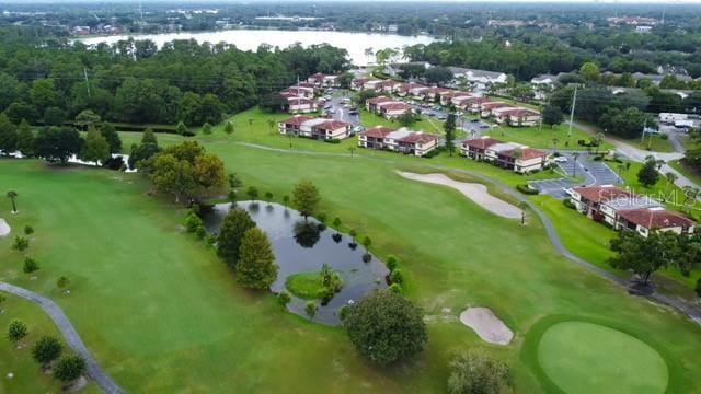 bird's eye view with a water view and golf course view