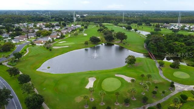 bird's eye view with view of golf course and a water view