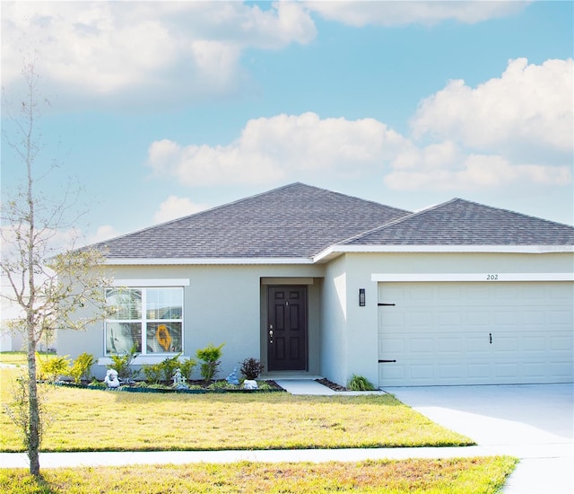 single story home with a shingled roof, a front lawn, stucco siding, a garage, and driveway