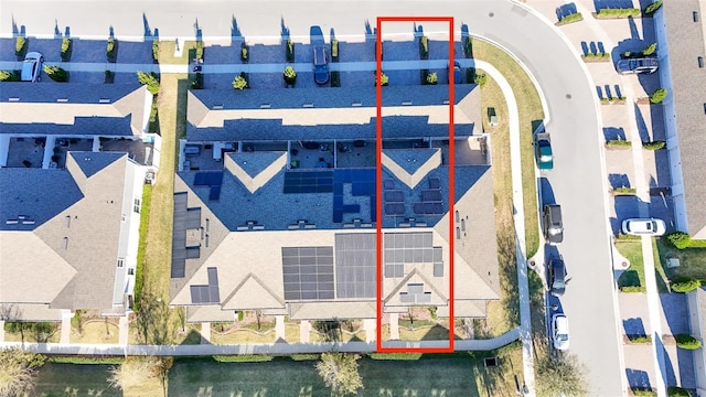 birds eye view of property with a residential view