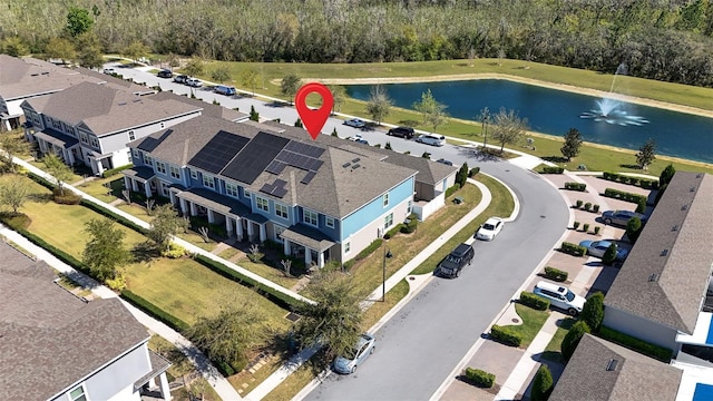 aerial view with a residential view and a water view