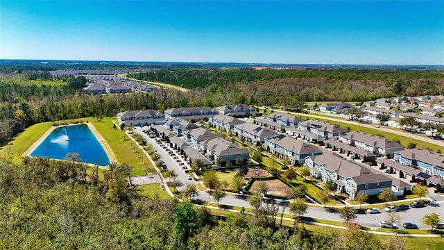 birds eye view of property featuring a residential view and a water view