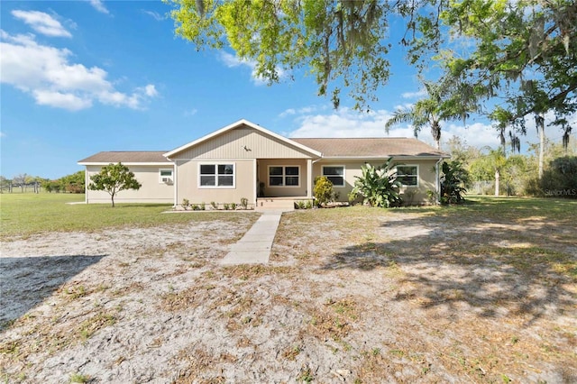 ranch-style house with a front lawn