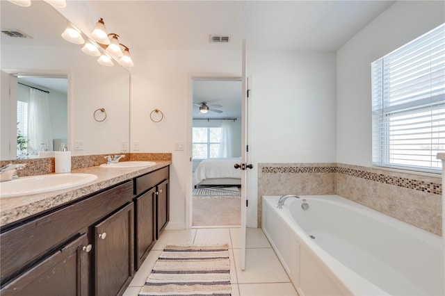 bathroom featuring tile patterned floors, visible vents, connected bathroom, and a sink