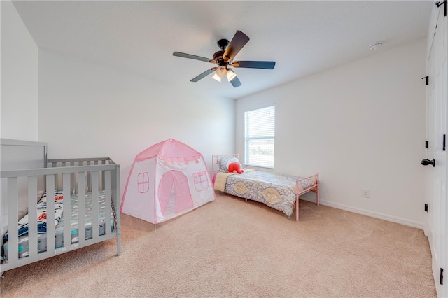 bedroom with baseboards, carpet floors, and ceiling fan