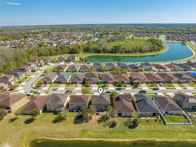 birds eye view of property featuring a residential view and a water view