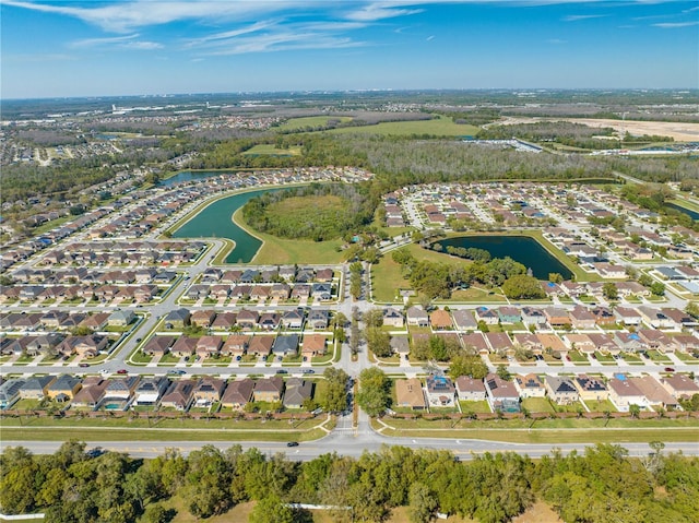 birds eye view of property featuring a residential view and a water view