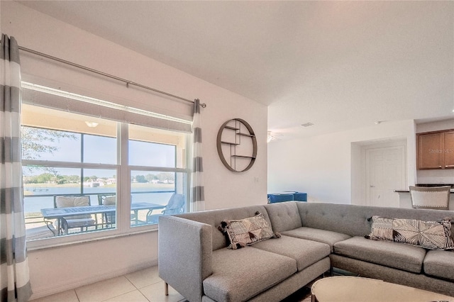 living room with plenty of natural light and light tile patterned flooring