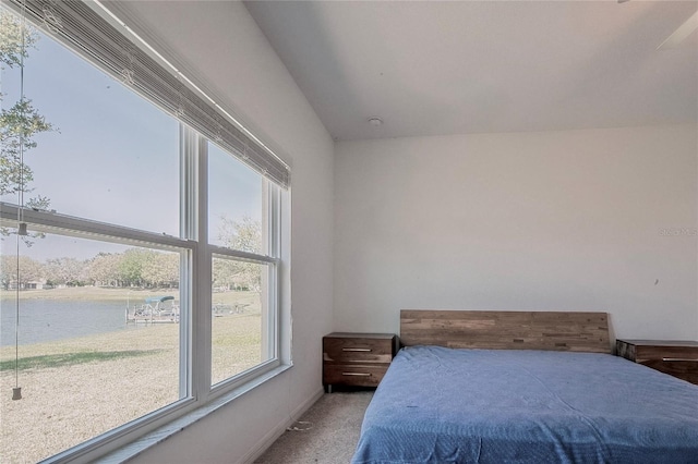 carpeted bedroom featuring baseboards