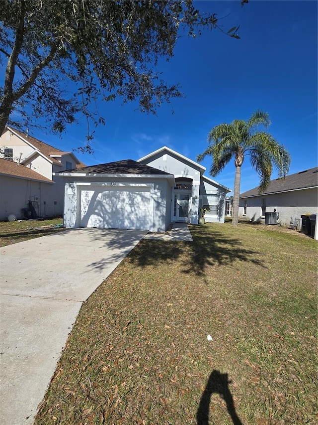 single story home featuring stucco siding, a front lawn, cooling unit, concrete driveway, and an attached garage