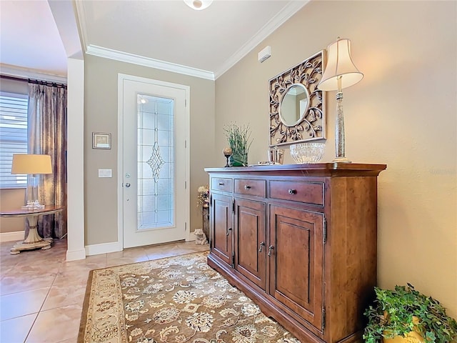 entryway with light tile patterned floors, baseboards, and ornamental molding