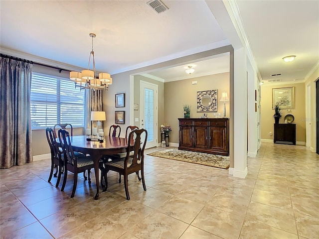 dining space featuring visible vents, an inviting chandelier, baseboards, and ornamental molding