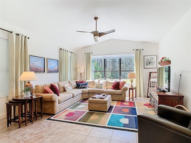 living room with tile patterned flooring, a ceiling fan, and vaulted ceiling