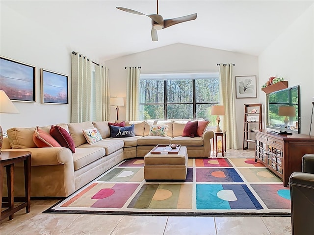 living room featuring a ceiling fan and lofted ceiling