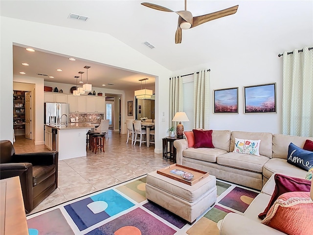 living room featuring lofted ceiling, recessed lighting, visible vents, and ceiling fan