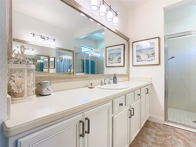 full bath featuring a stall shower and vanity