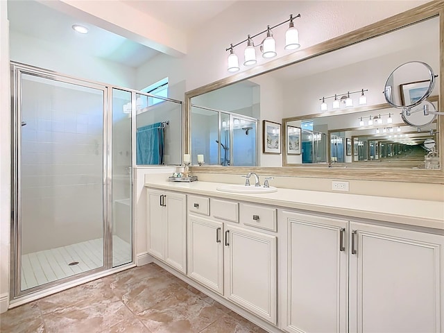 bathroom with beamed ceiling, a stall shower, and vanity