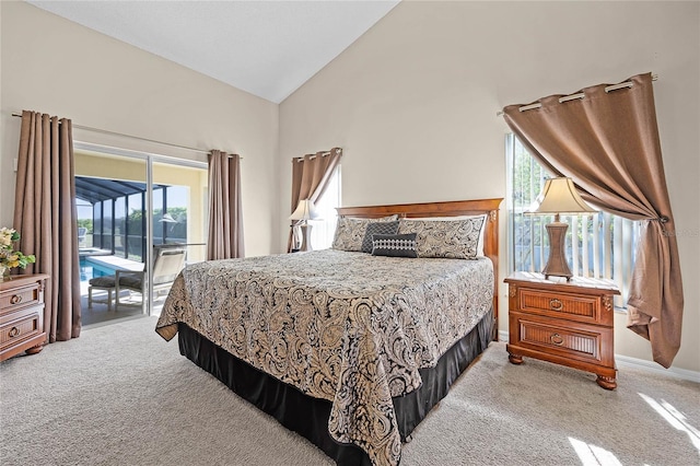 bedroom with light colored carpet, high vaulted ceiling, baseboards, and access to outside