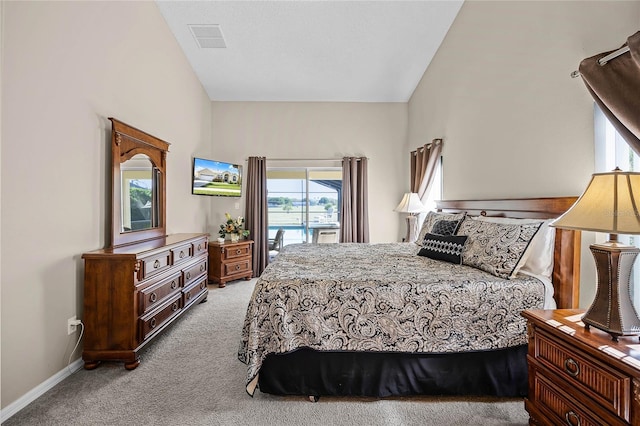 bedroom with visible vents, light carpet, baseboards, and access to exterior