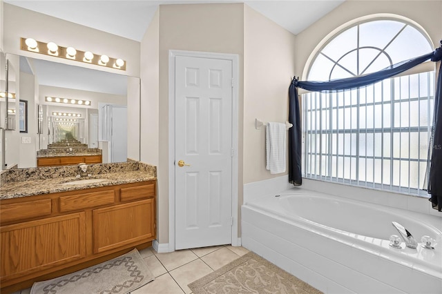 bathroom with tile patterned floors, a shower stall, a bath, and vanity