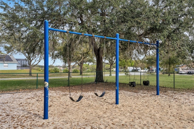 community jungle gym with volleyball court and fence