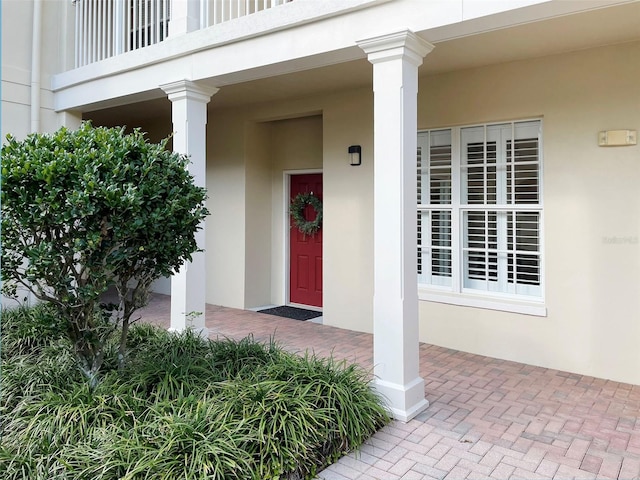 doorway to property with stucco siding