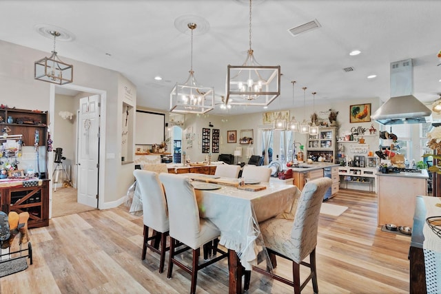 dining space with recessed lighting, visible vents, light wood-style flooring, and baseboards