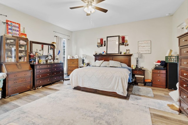 bedroom with light wood finished floors and ceiling fan