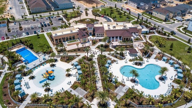 birds eye view of property with a residential view