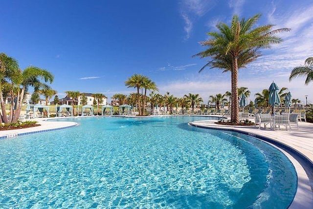 community pool with a patio area