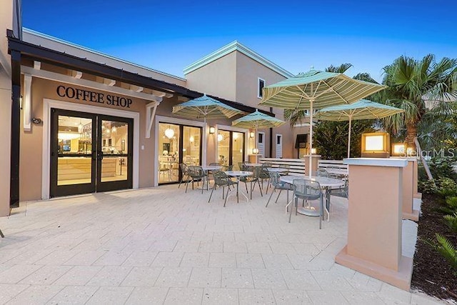 view of patio with french doors and outdoor dining space