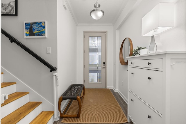 doorway to outside with stairway, wood finished floors, baseboards, and ornamental molding