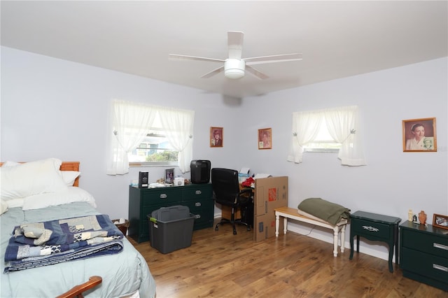 bedroom featuring ceiling fan and wood finished floors