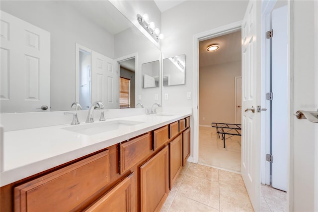 full bathroom featuring tile patterned flooring, double vanity, and a sink