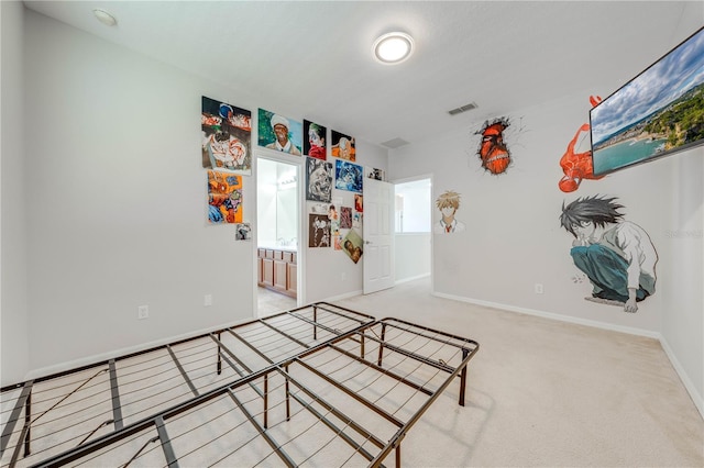 bedroom featuring visible vents, ensuite bath, baseboards, and carpet floors