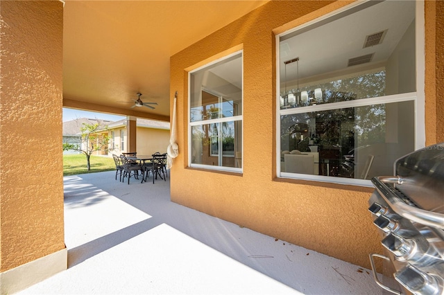 view of patio featuring outdoor dining area and visible vents