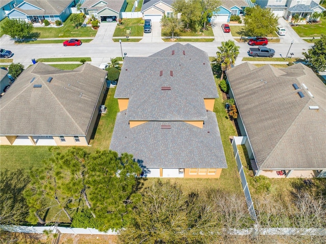 birds eye view of property with a residential view