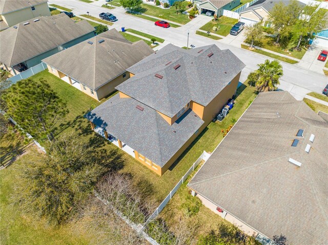 birds eye view of property with a residential view