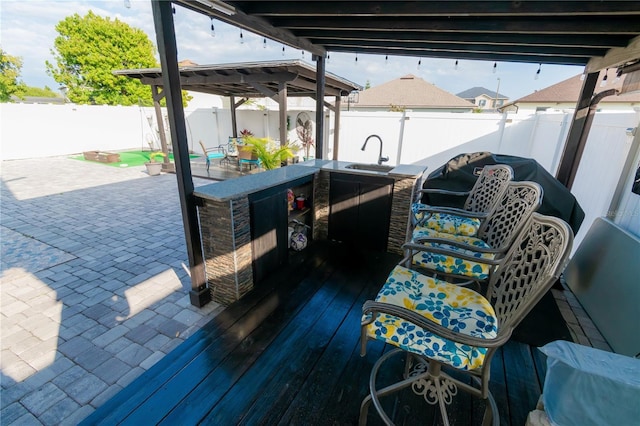 dock area with a sink and a fenced backyard