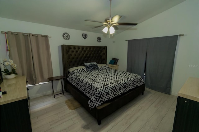 bedroom with ceiling fan, baseboards, and wood finish floors