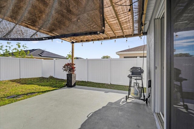 view of patio with a fenced backyard