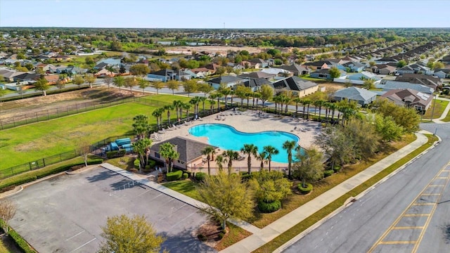 birds eye view of property with a residential view