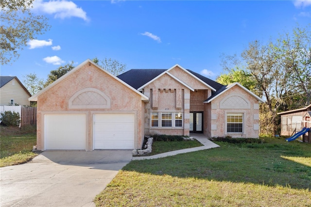 view of front facade with brick siding, a front lawn, concrete driveway, and a garage