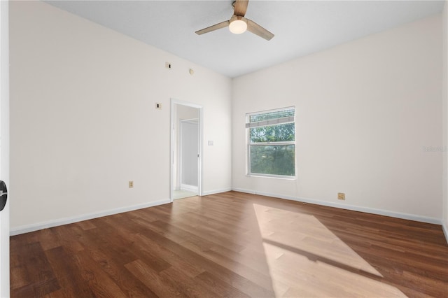 unfurnished room with ceiling fan, baseboards, and wood finished floors