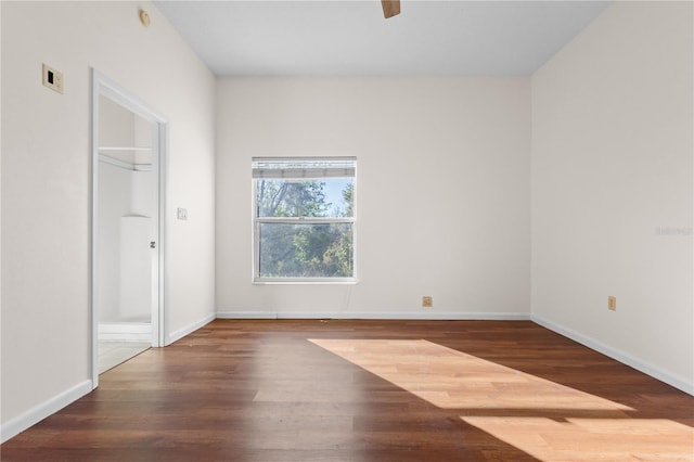 unfurnished bedroom with baseboards, wood finished floors, and a ceiling fan