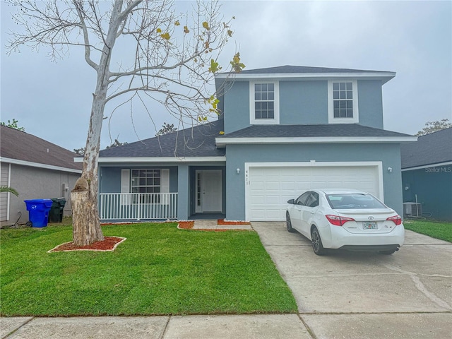 traditional-style home featuring a front yard, driveway, an attached garage, a shingled roof, and stucco siding